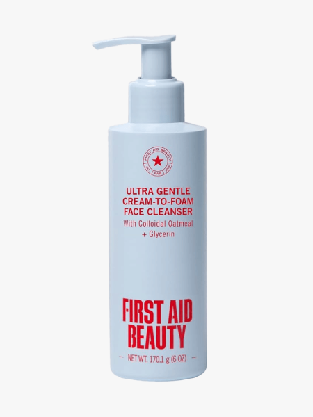 First Aid Beauty Ultra Gentle Cream-to-Foam Cleanser in branded component on a light gray background